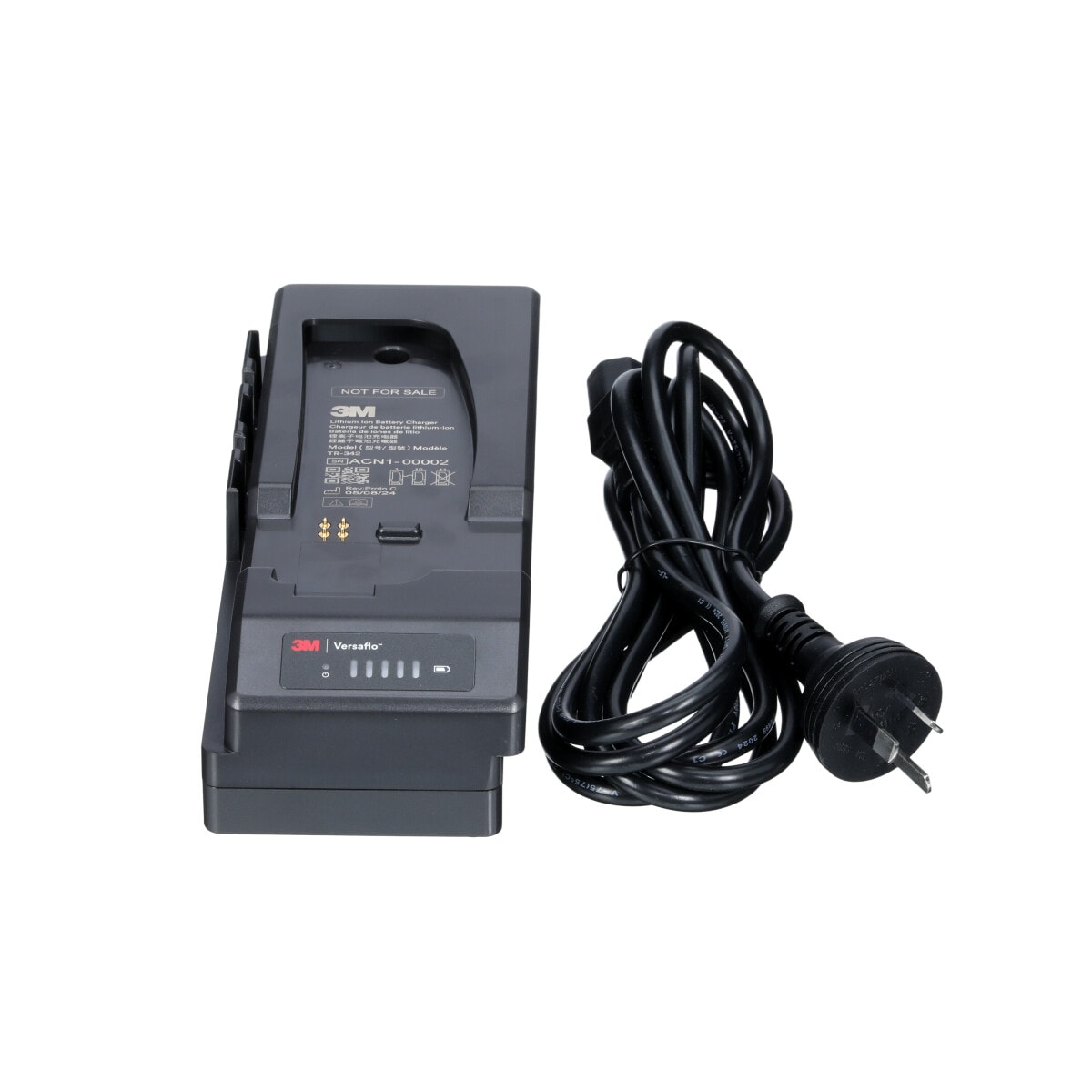 A 3M Versaflo Single Station Battery Charger Kit TR-342N beside power cord