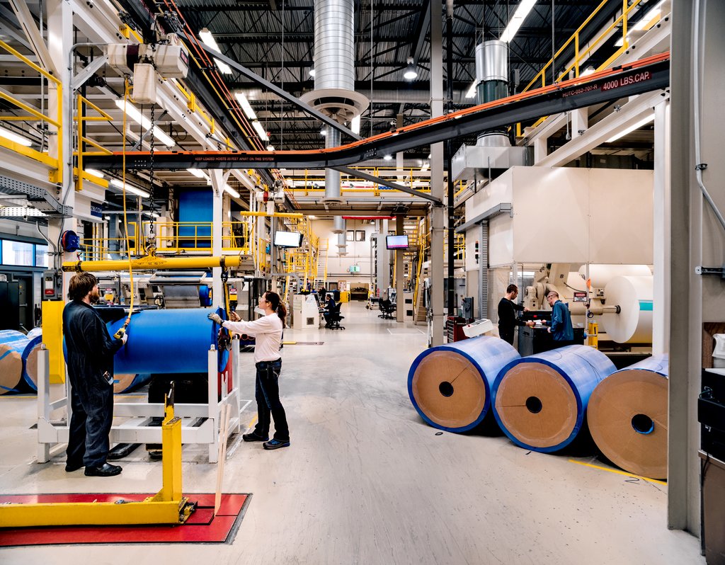 Two employees working in a manufacturing plant