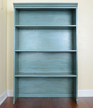 an empty blue bookshelf