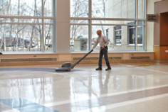 Man walking with swing machine, stone floor, wide angle