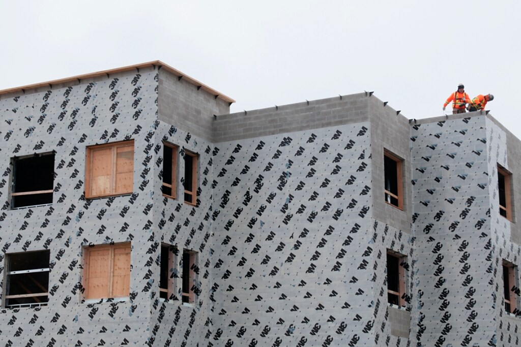 Building under construction wrapped in 3M insulation product