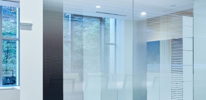 Glass walls in building with a blue tint 