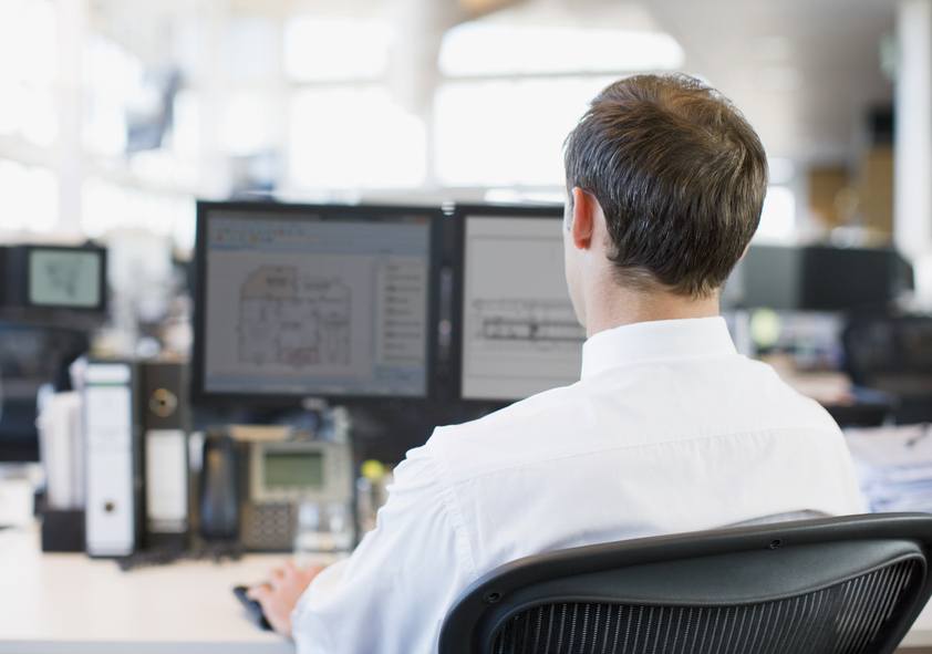 Businessman working at desk in office