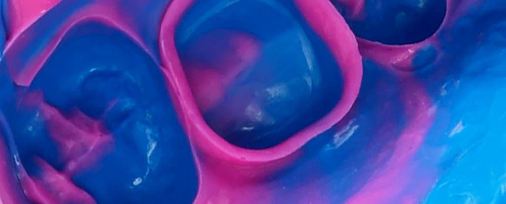 Close-up of blue and pink molar impressions