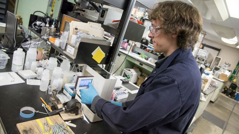 Intern Emmett working in lab