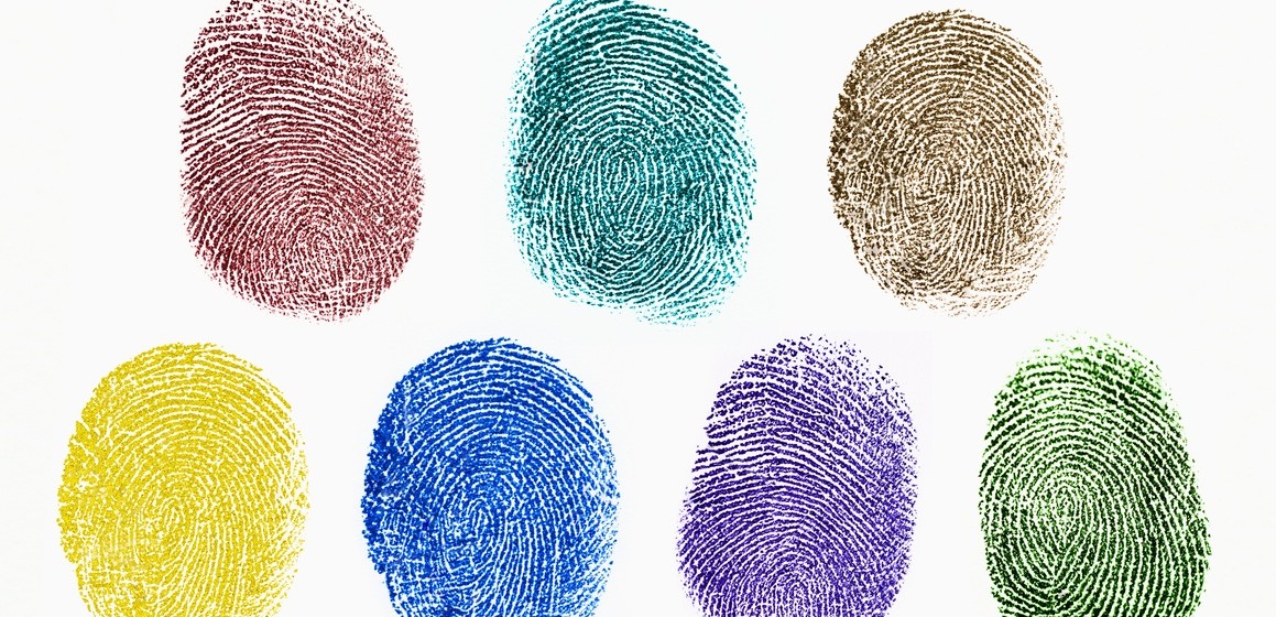 Close up of colorful fingerprints on white background