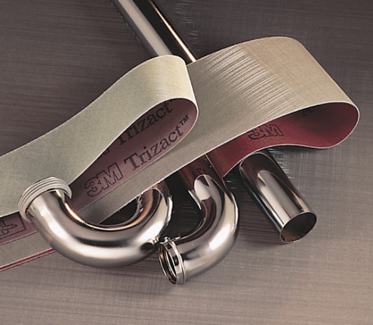 Two Trizact™ belts and three metal plumbing fixtures