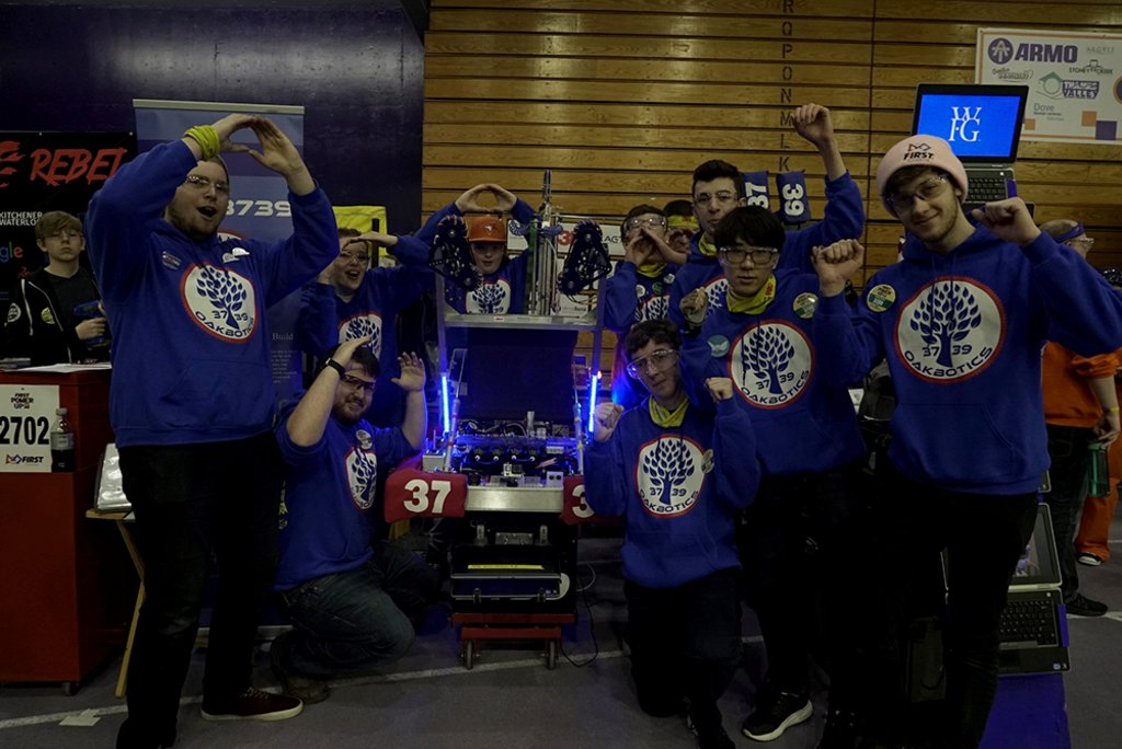 first robotics competition students with robot