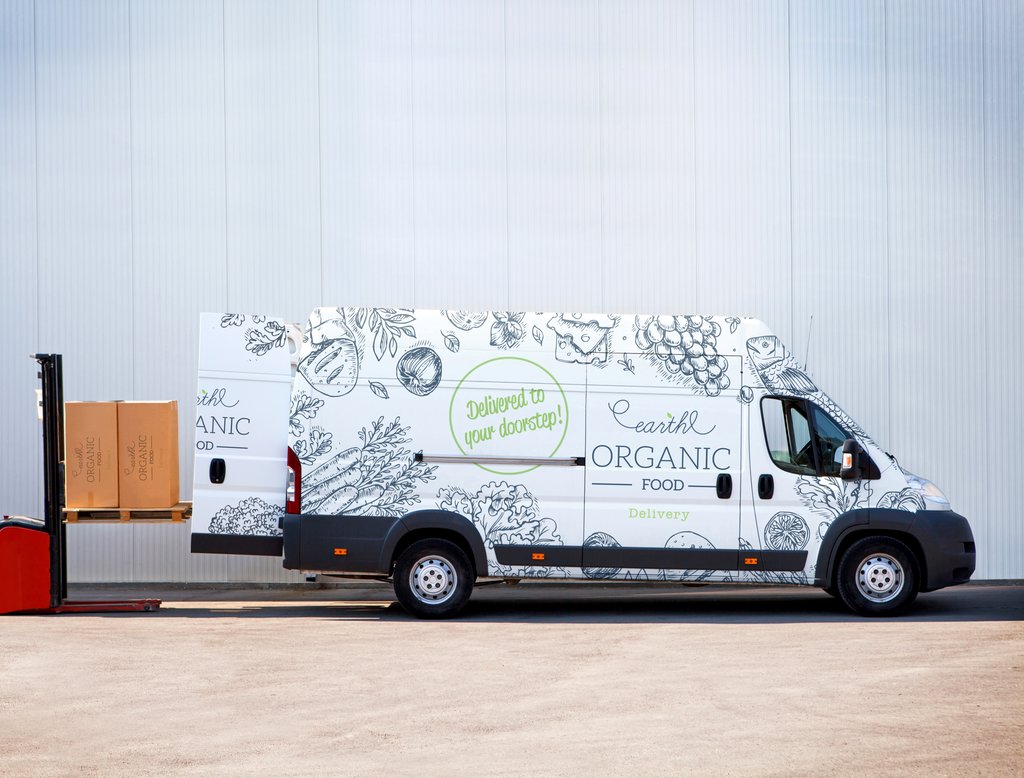 Cargo van branded with a vehicle wrap