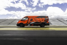 3M™ Print Wrap Film IJ280 with 3M™ Gloss Wrap Overlaminate 8428G red van  on race track wide shot
