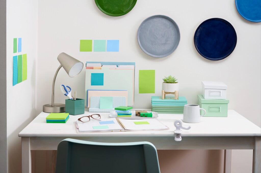 Workspace with colourful Post-it® Notes being used.