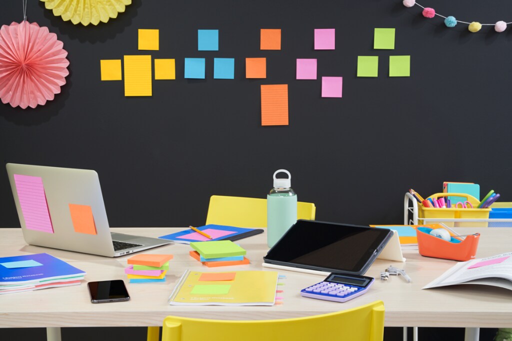 Workspace with colourful Post-it® Notes being used.