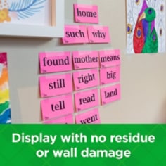 Scotch BTS Pack lifestyle image showing  student elementary aged vocabulary words taped to the wall with Scotch Wall-Safe Tape.