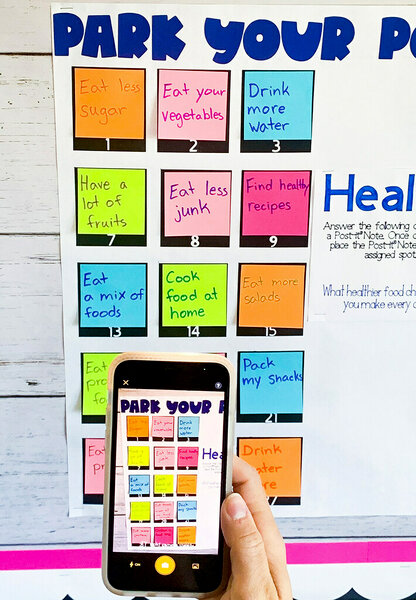 Using a smartphone with the Post-it® App to take a picture of the Post-it® Super Sticky Easel Pad paper with the attached Post-it® Super Sticky Notes.