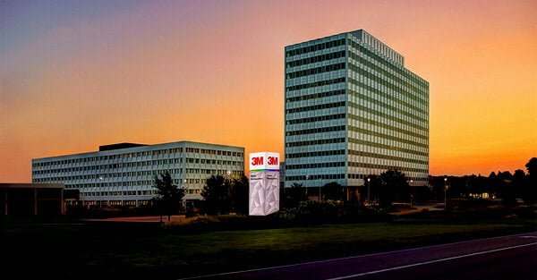 3M Corporate building set against a colorful sunset sky.
