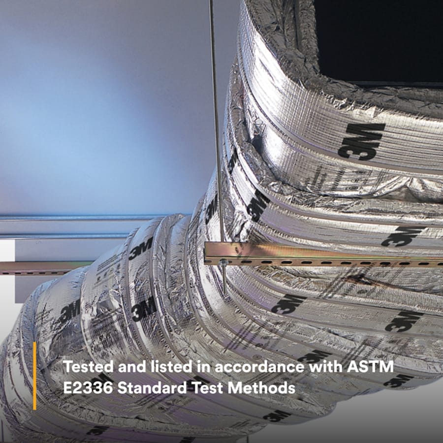 Silver 3M foil wrap installed around a curved commercial ventilation duct, supported by a metal bracket.