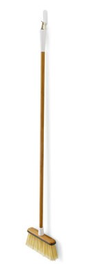 White Command wire hook with a broom hanging from it