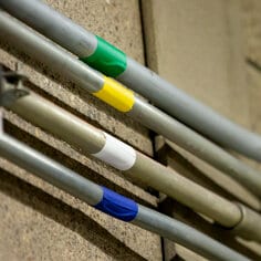 Rubber adhesive sticks fast and stays fast on many surfaces, even irregular surfaces. Embossed vinyl backing seals out dust, dirt, and moisture, and resists abrasion and many chemicals.