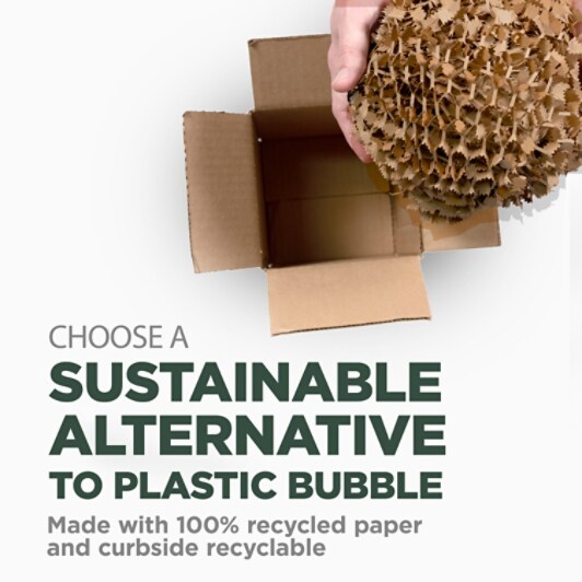 A nest of Cushion Lock™ being held over a box as a sustainable alternative to plastic bubble.