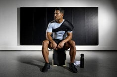 Man in gym wearing ACE shoulder wrap.