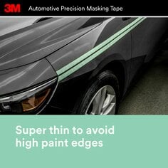 Teal green making tape applied to an automobile fender.