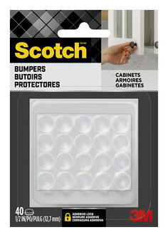 Scotch Bumpers in packaging. 20 bumpers visible in package. Package of 40. 1/2 in. A person's hand is shown closing a cabinet door.