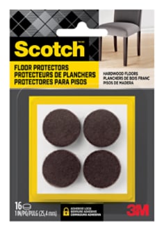 Scotch Floor Protectors in packaging. Four floor protectors are visible in the packaging. A chair sits on hardwood flooring.