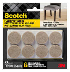 Scotch Floor Protectors in packaging. EIght floor protectors are visible in the packaging. A chair sits on hardwood flooring.