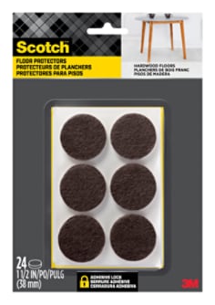 Scotch Floor Protectors in packaging. Six floor protectors are visible in the packaging. A table sits on hardwood flooring.