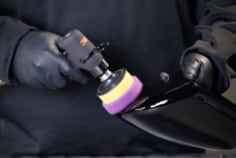 3M-finesse-it-pneumatic-rotary-buffer-purple-pad-on-vehicle-part-app-shot-2.tif
