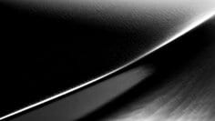 A swatch of 3M™ Wrap Film Series 2080 Brushed Black Metallic