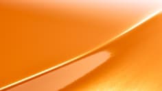 A swatch of 3M™ Wrap Film Series 2080 Gloss Deep Orange