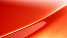 A swatch of 3M™ Wrap Film Series 2080 Gloss Flame Red