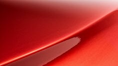 A swatch of 3M™ Wrap Film Series 2080 Gloss Dragon Fire Red