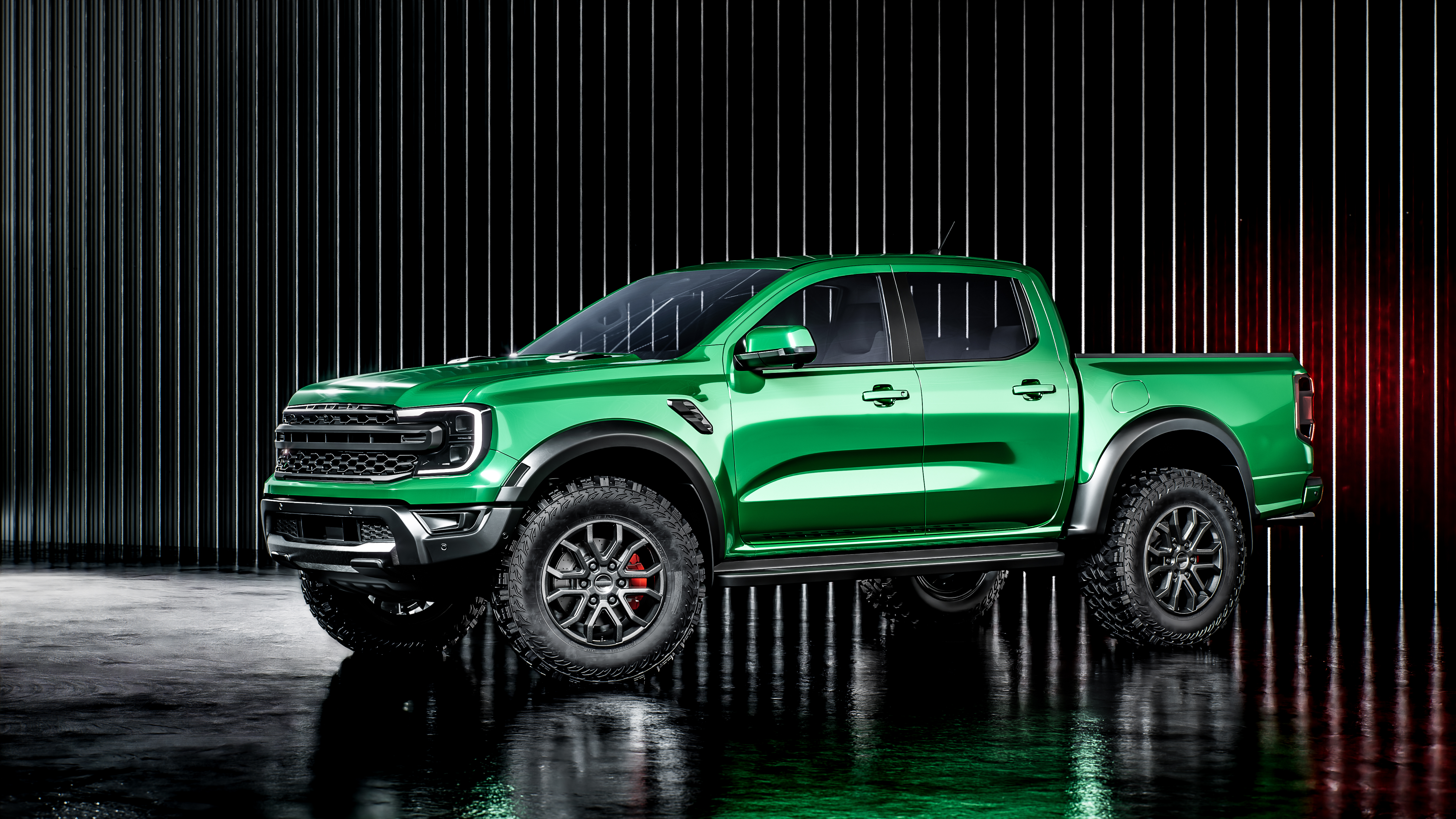 Side shot of a truck with green accent wrap.