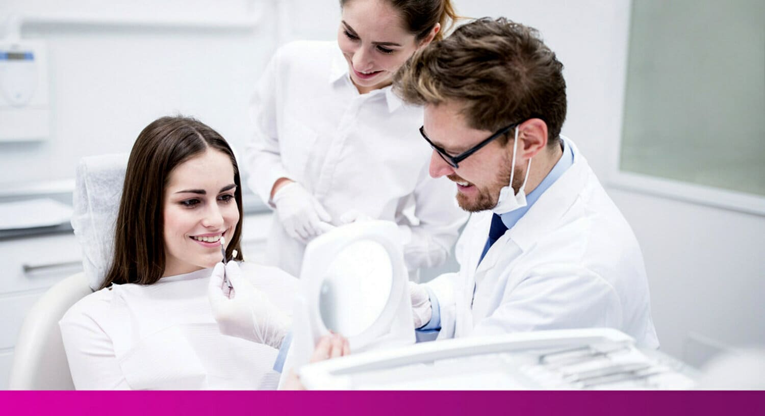 image of dentist colour matching cement to patient's teeth