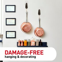Pots hanging on the wall with Command hooks. Damage-free hanging and decorating