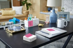 Post it notes dispenser with wife wave design on the sides. one pad of pink pop up notes included 