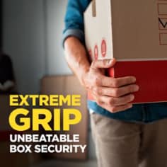 Scotch box lock shipping tape has extreme grip and unbeatable box security.  The image shows a person holding a moving box. 