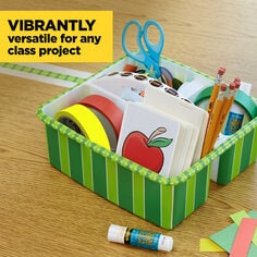Scotch Expressions Colored Masking Tape is vibrantly versatile for any class project.  A organizer caddy is decorated with green masking tape The caddy has school supplies in it.  