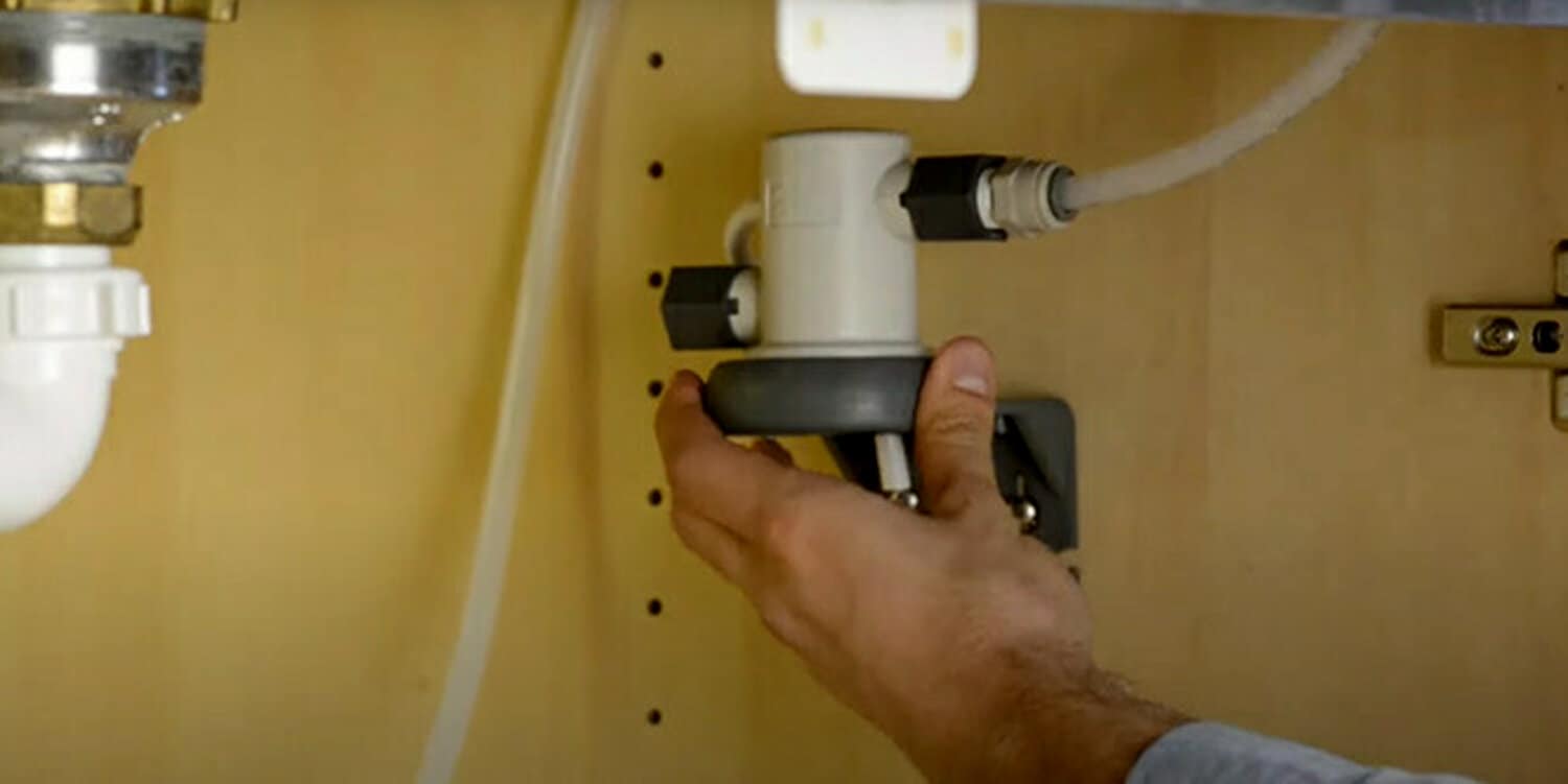 Image of faucet adapter being installed and connected to cold water line