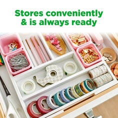 Scotch Stainless Steel Tape Dispenser stores conveniently and is always ready.  Image of tape dispenser in a junk drawer.