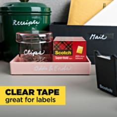 Scotch Super Hold Tape, clear tape that is great for labels.  Image of kitchen containers being labeled with Scotch super hold tape.