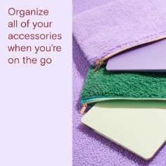 Organize all of your accessories when you're on the go.  Image of a purple and green laptop bag and two laptops. 