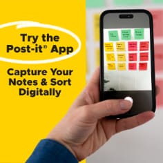 Try the Post-it App, capture your notes and sort digitally.  Image of a person taking a photo of Post-it Notes on the wall and using the Post-it App. 