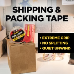 Scotch Box Lock Tape has extreme grip, no splitting and quiet unwind.  Image of a roll of Scotch Box Lock Tape and moving boxes.  Shipping & Packing Tape.