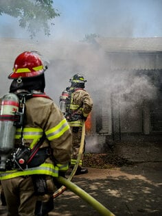 3M Scott Air-Pak XD SCBA worn by a firefighter at an exterior residential fire.