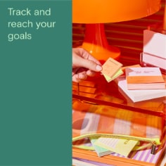 Track and reach your goals, image of a variety of Noted by Post-it notes and pen pouch. 