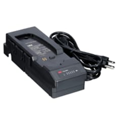 A 3M Versaflo Single Station Battery Charger Kit TR-342N beside power cord