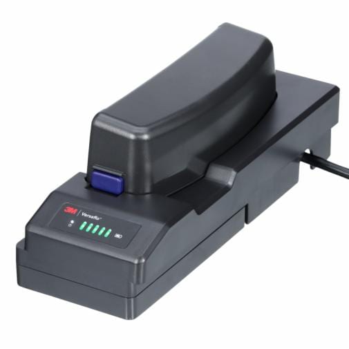 A 3M Versaflo Single Station Battery Charger Kit TR-342N, plugged in and powered on with bright LED lights